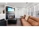 Bright and airy living room with large windows, a fireplace, and a comfortable sofa at 7108 Founders Club Ct, Charlotte, NC 28269