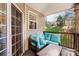 Cozy covered patio with comfortable seating and views of the lush backyard at 7108 Founders Club Ct, Charlotte, NC 28269