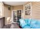Comfortable covered patio area with a plush seating arrangement and a view of the backyard at 7108 Founders Club Ct, Charlotte, NC 28269