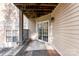 Covered patio features a sliding glass door and a brick foundation at 7108 Founders Club Ct, Charlotte, NC 28269
