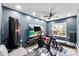 Spacious workout room featuring modern fitness equipment, mounted television, and neutral paint color scheme at 7108 Founders Club Ct, Charlotte, NC 28269