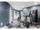 A modern workout area featuring stationary bike, punching bag, laundry room and neutral paint color scheme at 7108 Founders Club Ct, Charlotte, NC 28269