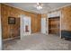 Bedroom with wood paneling, built in shelving and carpet at 10310 Stokes Ferry Rd, Gold Hill, NC 28071