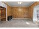 Simple bedroom with wood paneling and carpeted floors at 10310 Stokes Ferry Rd, Gold Hill, NC 28071