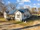 Ranch home with blue metal roof, covered porch, and large yard at 10310 Stokes Ferry Rd, Gold Hill, NC 28071