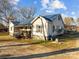 Ranch home with blue metal roof, covered porch, and large yard at 10310 Stokes Ferry Rd, Gold Hill, NC 28071