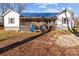 Ranch home with blue metal roof and a spacious front porch at 10310 Stokes Ferry Rd, Gold Hill, NC 28071