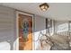 Front porch detail with wooden door and welcome mat at 10310 Stokes Ferry Rd, Gold Hill, NC 28071