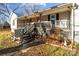 Front porch with wooden swing and steps leading to the front door at 10310 Stokes Ferry Rd, Gold Hill, NC 28071