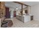 Kitchen boasts an island and stainless steel refrigerator at 10310 Stokes Ferry Rd, Gold Hill, NC 28071