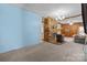 Living room featuring a brick fireplace and wood stove at 10310 Stokes Ferry Rd, Gold Hill, NC 28071