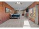 Main bedroom with wood walls and large windows at 10310 Stokes Ferry Rd, Gold Hill, NC 28071