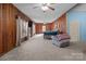 Spacious main bedroom with wood walls and ceiling fan at 10310 Stokes Ferry Rd, Gold Hill, NC 28071