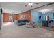 Spacious main bedroom with wood paneled walls and ceiling fan at 10310 Stokes Ferry Rd, Gold Hill, NC 28071