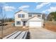 Two-story house with attached garage and landscaping at 114 Four Andrews Dr, Harmony, NC 28634