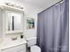 Clean bathroom with vanity, toilet, and shower at 11813 Fox Glen Rd, Charlotte, NC 28269