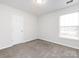 Simple bedroom with carpet and a closet at 11813 Fox Glen Rd, Charlotte, NC 28269