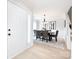 Formal dining room with light floors and modern chandelier at 11813 Fox Glen Rd, Charlotte, NC 28269