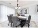 Modern dining room featuring a gray table and stylish decor at 11813 Fox Glen Rd, Charlotte, NC 28269