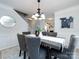 Spacious dining area with staircase view and modern chandelier at 11813 Fox Glen Rd, Charlotte, NC 28269