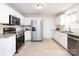 Updated kitchen, featuring stainless steel appliances and white cabinets at 11813 Fox Glen Rd, Charlotte, NC 28269