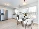 Modern kitchen with breakfast area, white cabinets and stainless steel appliances at 11813 Fox Glen Rd, Charlotte, NC 28269