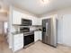 Modern kitchen with stainless steel appliances and granite counters at 11813 Fox Glen Rd, Charlotte, NC 28269