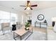 Living room with light walls, hardwood floors, and a fireplace at 11813 Fox Glen Rd, Charlotte, NC 28269