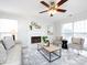 Living room with light walls, hardwood floors, and a fireplace at 11813 Fox Glen Rd, Charlotte, NC 28269