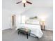 Spacious main bedroom with king-size bed and ceiling fan at 11813 Fox Glen Rd, Charlotte, NC 28269