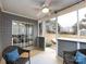 Relaxing screened porch with ceiling fan and wicker chairs at 11813 Fox Glen Rd, Charlotte, NC 28269