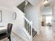 View of staircase leading upstairs, with view into kitchen area at 11813 Fox Glen Rd, Charlotte, NC 28269