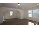 Carpeted bedroom featuring natural light from three windows at 2608 Clipper Nw Ct, Concord, NC 28027