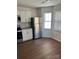 Updated kitchen featuring stainless steel refrigerator and wood-look flooring at 2623 Trumpet Ct, Fort Mill, SC 29715