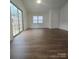 Bright living room with vinyl plank flooring and sliding glass doors leading to the outdoors at 2623 Trumpet Ct, Fort Mill, SC 29715