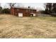 Large backyard with a brick home and detached garage at 325 Hunter St, Salisbury, NC 28144