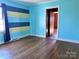 Bedroom with hardwood floors and two-toned painted walls at 325 Hunter St, Salisbury, NC 28144