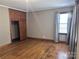 Hardwood floors and built-in wardrobe in this cozy bedroom at 325 Hunter St, Salisbury, NC 28144