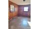 Simple bedroom with wood paneling and a window at 325 Hunter St, Salisbury, NC 28144