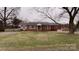 Brick ranch house with a large front yard and mature trees at 325 Hunter St, Salisbury, NC 28144