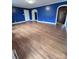 Hardwood floor living room with blue walls and archways at 325 Hunter St, Salisbury, NC 28144