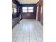 Bright sunroom with tile floors and wood paneling at 325 Hunter St, Salisbury, NC 28144