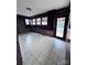 Sunroom featuring tile floors and built-in shelving at 325 Hunter St, Salisbury, NC 28144