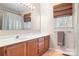 Bathroom with double sink vanity, shower, and tiled floor at 3706 Selwyn Farms Ln # 17-3, Charlotte, NC 28209