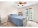 Bedroom with double bed, ceiling fan, and French doors at 3706 Selwyn Farms Ln # 17-3, Charlotte, NC 28209