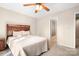 Bedroom with wood-like headboard and access to bathroom at 3706 Selwyn Farms Ln # 17-3, Charlotte, NC 28209