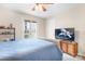 Bedroom with large TV and access to balcony at 3706 Selwyn Farms Ln # 17-3, Charlotte, NC 28209