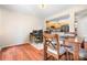 Dining area with hardwood floors and kitchen access at 3706 Selwyn Farms Ln # 17-3, Charlotte, NC 28209