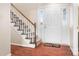 Stairway and front entry with hardwood floors at 3706 Selwyn Farms Ln # 17-3, Charlotte, NC 28209