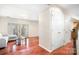 Bright entryway with hardwood floors and coat closets at 3706 Selwyn Farms Ln # 17-3, Charlotte, NC 28209